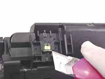 Make sure you hold this cartridge in an upright position before creating a refill hole (some remaining or excess toner can and may fall out of the cartridge).