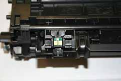 Make sure you hold this cartridge in an upright position before creating a refill hole (some remaining or excess toner can and may fall out of the cartridge).