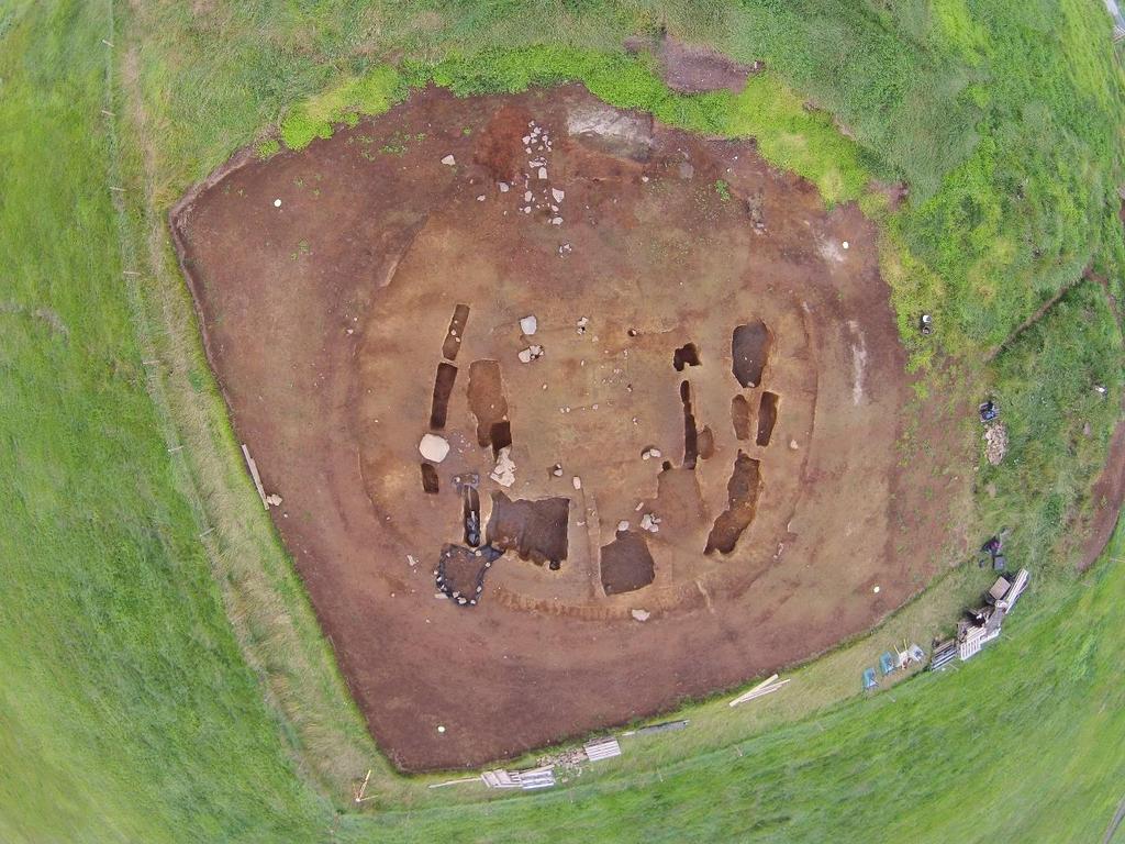 Figure 3. The cemetery at the end of the 2016 excavation season. The line of spade marks [153] is visible inside the southeastern (lower) part of the cemetery wall.
