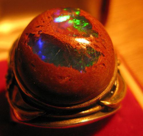 A small charge of dynamite is often used to break up the rhyolite rock. The opal is in pockets and seams in the rock. Opal mining is a risky business.