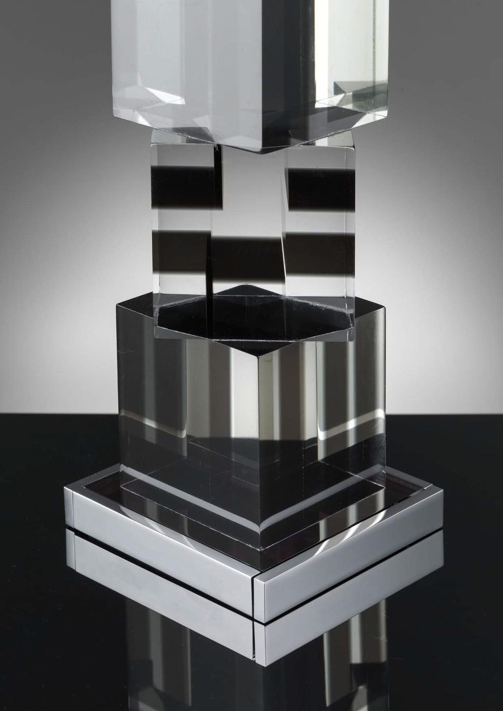 Charcoal block Lamp ILLMWABL A complex construction of clear and charcoal opaline plexiglass in a concert of square and recatangular shapes, is used to compose the single blocks which make up this