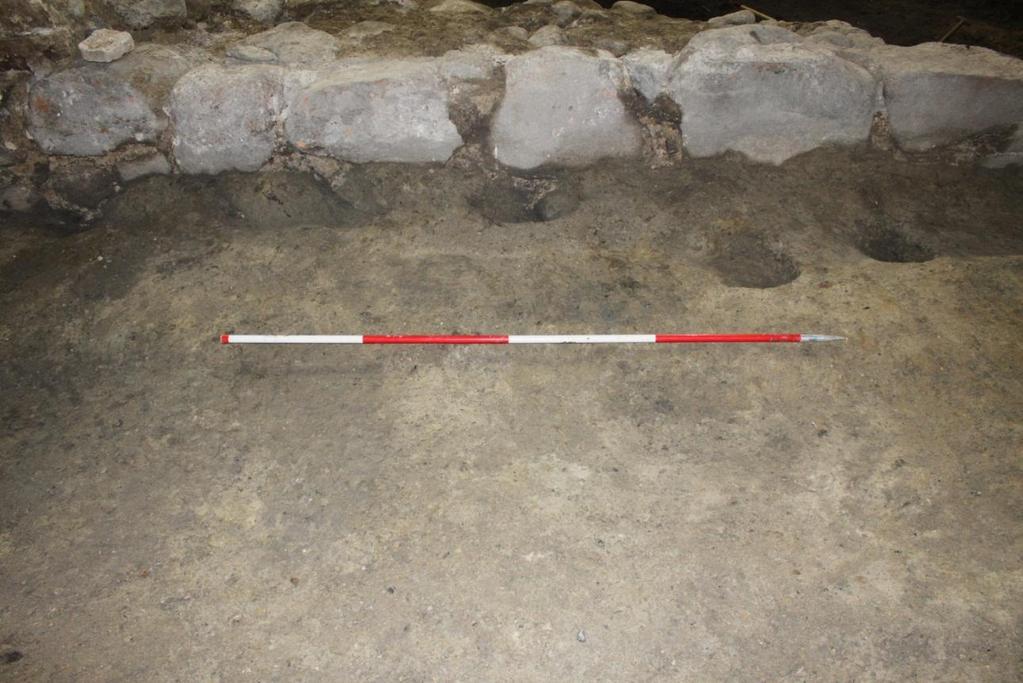 Fig. 113. Post-excavation. Cuts (SC35347) row of interpreted scaffolding holes within the gateway area, facing north. Photo: Museum of Copenhagen. In the SE room of the building a well was recorded.