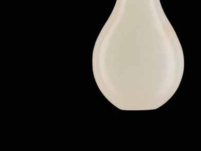 27 A PEAR-SHAPED PLAIN WHITE JADE SNUFF BOTTLE, QING DYNASTY Almost pure white jade with tiny russet inclusions, smooth surface polish China, 18 th to 19 th century While plain white jade bottles are