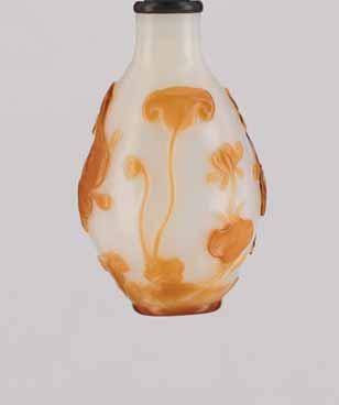 42 A GLASS JADE-IMITATION DISK-SHAPED SNUFF BOTTLE, QING DYNASTY Glass of even, creamy-white color in imitation of mutton fat jade, the surface polish revealing a similar oily feeling as the real