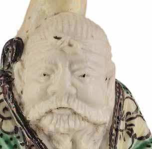 56 A CARVED FAMILLE VERTE PORCELAIN HUGONG SNUFF BOTTLE, QING DYNASTY Carved porcelain with enamel painting China, 19 th century, likely 1830-1880 The molded porcelain bottle well carved to depict Hu