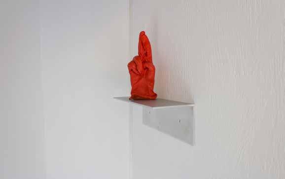 Joker (1) Red leather glove, clay 8 x 21 x 5,5 cm, aluminium shelf 30 x 11 x 10 cm, 2014 View of the solo show: Adult, Island, Brussels, 2016.