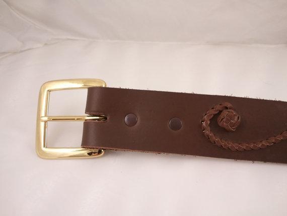 dark brown and the braid is a medium brown This uniquely designed belt is definitely one-of-a-king.