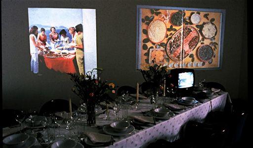 A Gourmet Experience (1974), an installation by Ms. Rosler with banquet table, video, audio and more.
