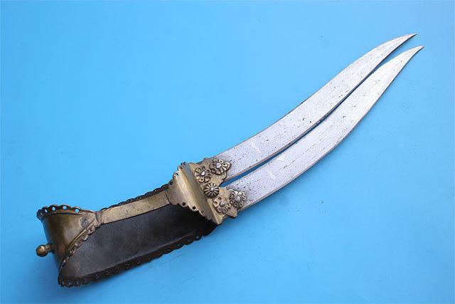 Gold koftgari decoration on both faces. Massive horn grips with brass rivets heads. Total length 24 63 inches. Very good condition. Losses to the gold inlay. Scabbard cover is newly made.