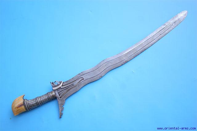 This Kris is an early version, probably late 18 to early 19 C. The fine blade is forged from twisted steel core, forge welded between high carbon steel hard edges.