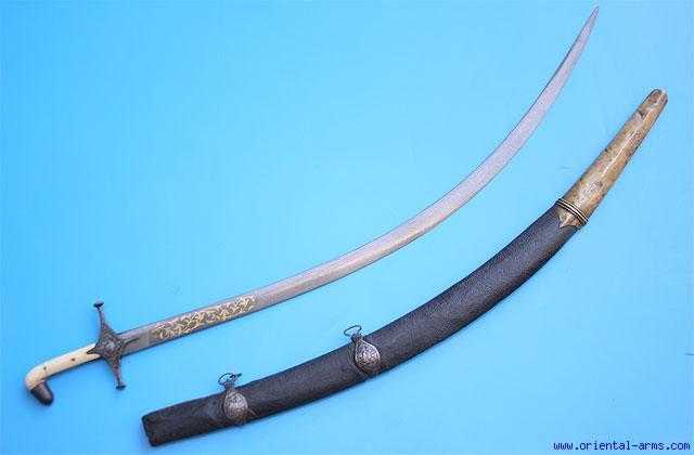 its single edge blade is 8 inches 8724 long, forged from pattern welded steel in the pattern known asturkish Ribbon. The Handle is covered with chased silver as well as the 74 scabbard.