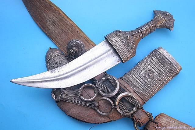 Very good condition. Natural age cracks in the grips and few very minor blackened spots on the blade. No scabbard.
