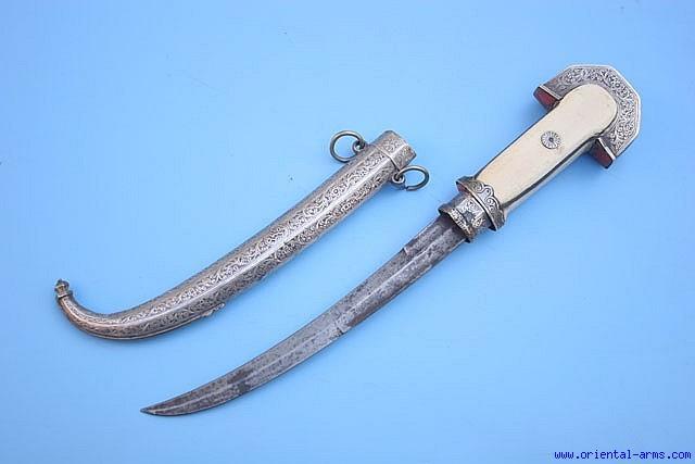 The Moroccan version of the Arab Jambiya dagger is locally called Koumaya and characterized by a slender blade, usually dual edged at its lower half and single edge at the top.