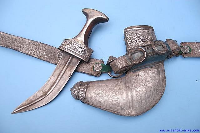 Fine engraved silver scabbard with typical floral design and side 38 loops, marked in the center with a proof mark with Arabic letters and figures and probably dated The hilt is covered with fine