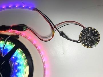 Twist the red wire from your JST connector together with the red wire coming from the NeoPixels, and solder on a third red wire which will connect to the screw
