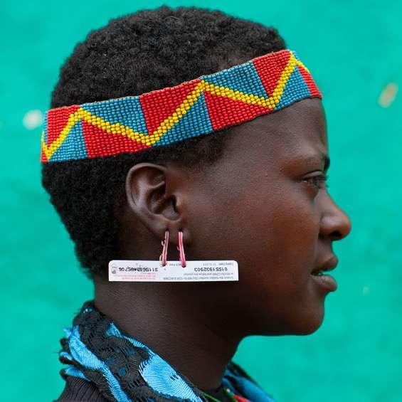 Men and women of both the Bana and the Hamer tribes are seen adorning the phone cards as