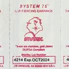 The seal of the blister pack of the original STUDEX System75 cartridge shows the STUDEX logo, the name, SYSTEM75, and a date by when the sterility of the earring and clasp is guaranteed.