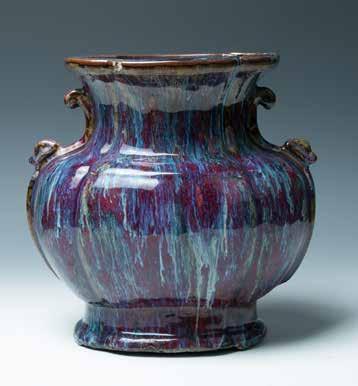 H:6cm $4000-$6000 105 十八世纪窑变釉瓶 Of four-lobed section with everted neck and foot, the body overall covered with a deep reddish-purple glaze