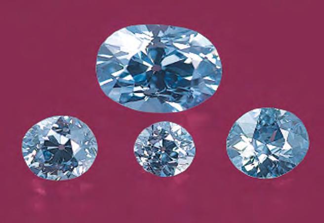Figure 3. The four main blue diamonds are shown here removed from the necklace. The Fancy Intense blue oval at top weighs 2.