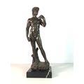 17. Cast bronze figure of a standing lady and lily pad, on marble base, approx 10'' tall 40-70 25. Painted cast metal Texaco advertising moneybox, approx 8'' tall 18.
