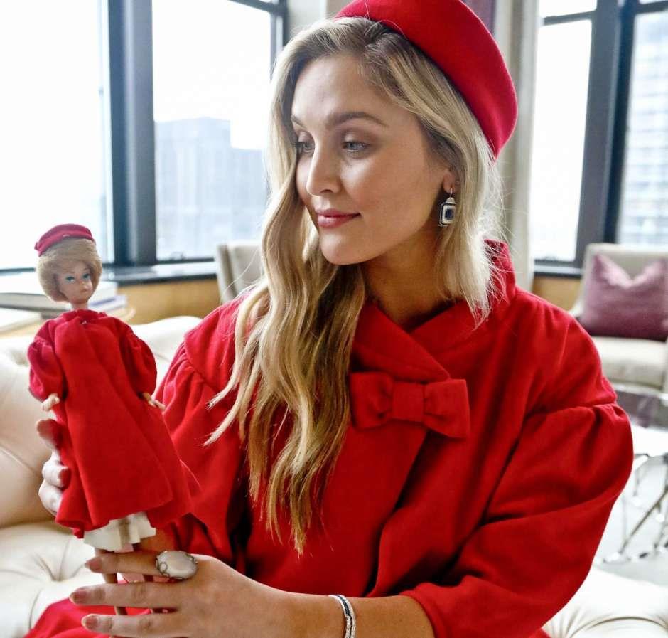2 of 10 In this Nov. 5, 2018 photo, model Kelsey Elliott holds a Barbie doll while wearing a matching outfit from designer Katie Echeverry in New York.