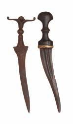 42 43 44 42 TWO SOUTH INDIAN DAGGERS, CHILANUM, 16TH/17TH CENTURY, PROBABLY DECCAN the first formed entirely of steel (rust patinated), with recurved fullered blade, steel hilt formed with a pair of