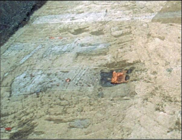 4.4.4 THE MITHRAEUM In 1998 the enigmatic remains of an unidentified building together with a number of pits containing very rich deposits were excavated in the southwestern periphery of the vicus of