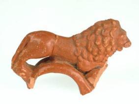 Fig. 4.163. Tienen, Grijpenveld. Handles of a krater from Rheinzabern with lion and snake in samian ware from mithraeum.