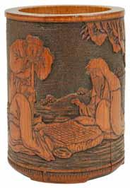 A 19th century Chinese carved bamboo brush pot carved with a scene of two seated figures playing Go, and another standing observer, the reverse carved with character