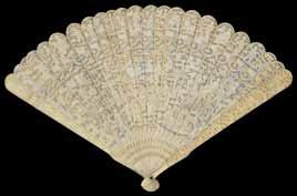A large early 20th century Chinese Canton carved ivory fan finely carved and pierced on both sides with flowers, leaves and temples, length 24cm 300-500 230.
