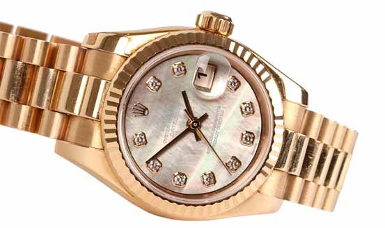 Jewellery & Watches 246 246. A ladies 18ct gold Rolex Oyster Perpetual Datejust bracelet watch with mother-of-pearl dial set with diamond batons, Model no. 179175.