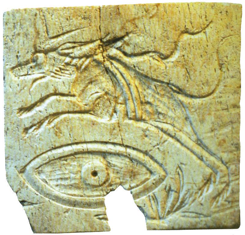 Bone plaque with hunting dog leaping over eye.
