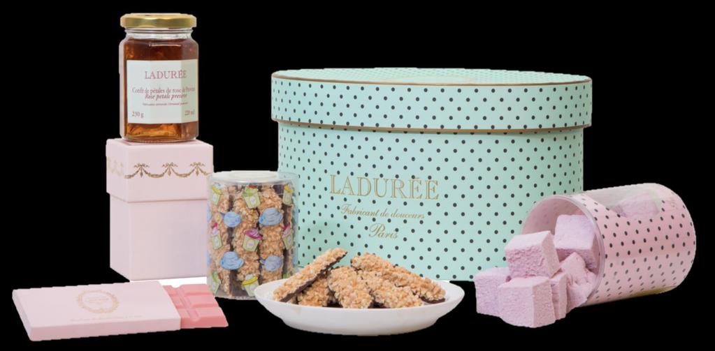 The green Pink Mademoiselle hamper with dots is filled with: 1 Green hat box with dots 1 Pink gift box of jam of your choice 1 Box of