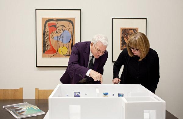 Steve Martin and Cynthia Burlingham have worked with an Ontario curator on a show of paintings by the Canadian artist Lawren Harris. Credit John Francis Peters for The New York Times Ms.