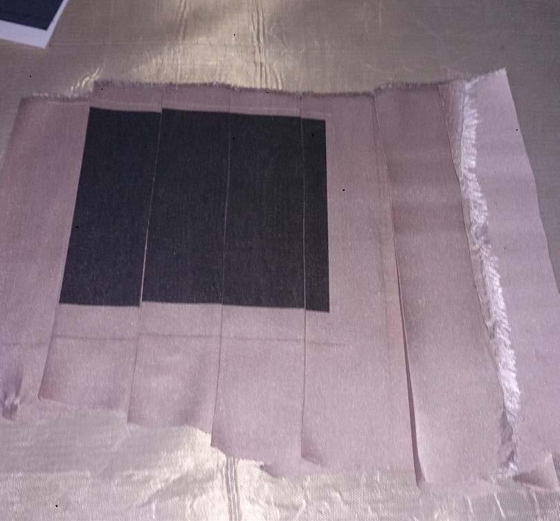 The fabric is black with a white square and when moving the hidden