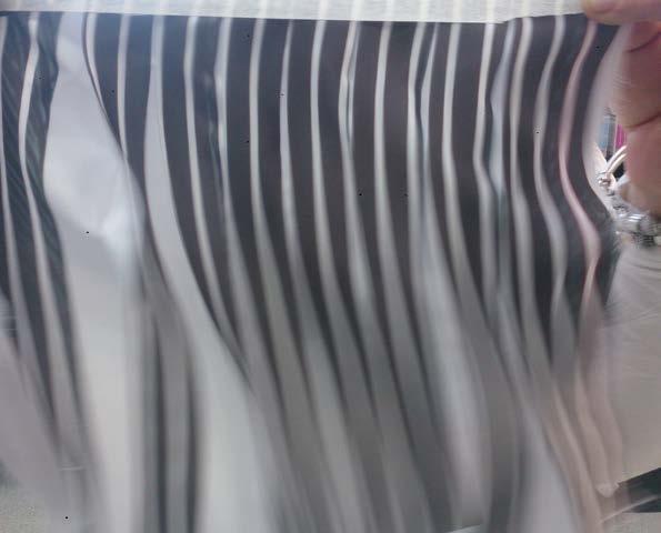 The stripes takes focus from the pleats and the viewer