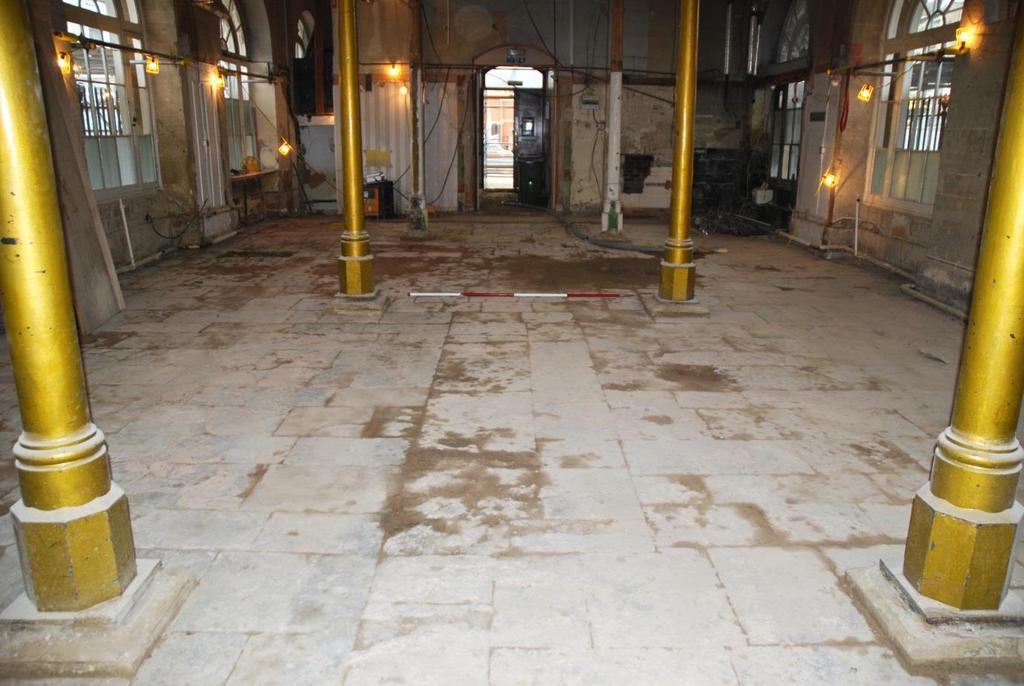 The exposed flagged floor was drawn at 1:20 scale in a series of traditional archaeological plans, executed in order to make a record suitable for selecting flags for re-use and replacement on (if