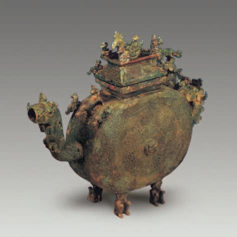 8 cm in mouth diameter. Bronze yi-ewer, 1 piece (M1:14). It takes the form of scoop, with an up-lifting spout, a deep body, and a flat bottom.