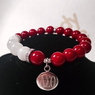 Delta Sigma Theta Sorority big beads red and white Price: 15 Item Type: Bracelets Setting Type: Bar Setting Clasp Type: Hidden-safety-clasp Material: Rhinestone