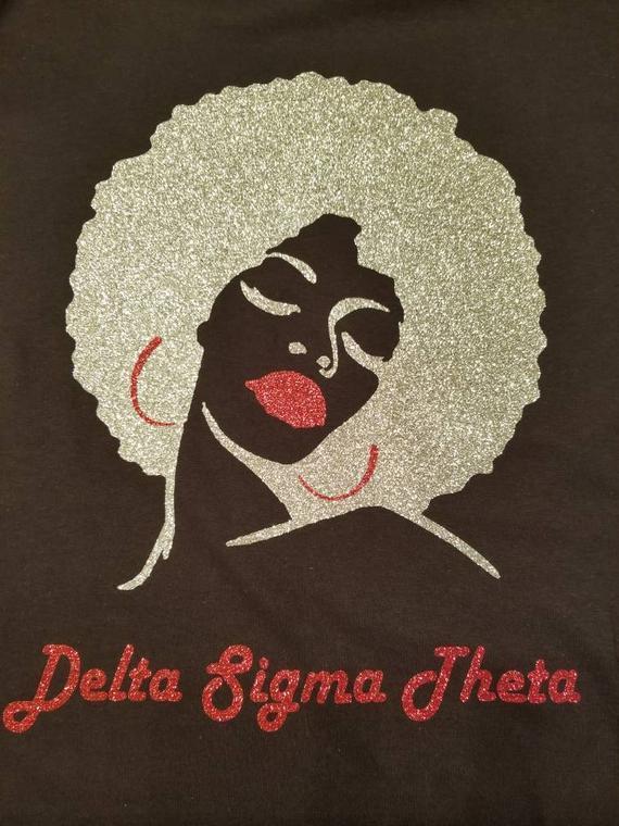 DST Afro Girl Rhinestone T-Shirt Price: 32 Shirt Information Sheet Rhinestone T-shirt. Customization is available for any shirts. Email us at blingthatsingz@gmail.com for more information.