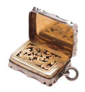 * 60-80 260 260 260 A Victorian silver vinaigrette, maker Colen Cheshire, London, 1877 initialled, with foliate engraved decoration, with hinged pierced gilded grille, 4cm. wide.0.83ozs.
