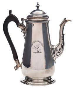 * 200-300 299 A George III silver teapot stand, maker s mark worn London, 1788 crested and initialled, of cartouche-shaped outline with flowerhead border, raised on four talon and ball feet,