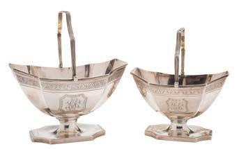 decoration, having scroll handle and on circular spreading foot, 7.5cm. high, 2.73ozs. * 60-80 351 A George III silver swing-handled sugar basket, maker H.