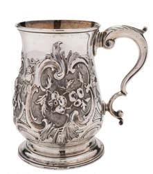 high, together with another unmarked silver cream jug raised on ball feet, 11cm. high, total weight of silver 9.19ozs.