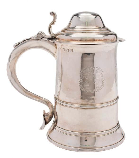 365 A George III silver tankard, maker William Turton, London, 1776 crested and initialed, with stepped domed hinged lid with scroll thumbpiece, of cylindrical