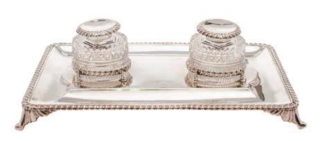 * 300-400 167 An Edward VII silver desk stand, maker Fenton Brothers Ltd, Sheffield, 1901 of rectangular outline, with two clear glass and silver mounted inkwells, with gadrooned