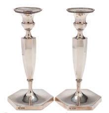 196 A pair of Edward VII silver candlesticks, maker Hawksworth Eyre & Co Ltd, Sheffield 1902 initialled, of hexagonal tapering outline on