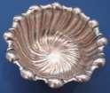 CA528 CA530 $14.00 SILVER PLATED 2 3/4" DIA, 1" HIGH $25.00 STERLIN SILVER 2 7/8" L, 2 1/8" W, 1/2" H NEEDS POLISH SILVER PLATED ROUND SCALLOPED RIM WITH TWIST DESIGN IN BOWL.