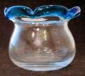 BUBBLES IN GLASS ROUND GLASS BULGING SIDE BOWL. 1 5/8 OPENING. RING BASE. PLAIN BASE.