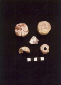 108 KAOLINITE / LITHOMARGE Fig. 1: objects of lithomarge; top left, disc from Hoddom; top right, disc from Barhobble; centre, flake from Hoddom; below, whorls or beads from Whithorn.